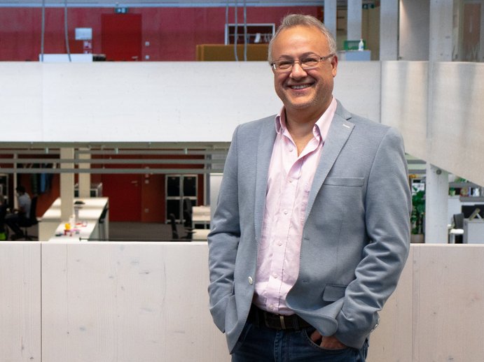 Pedro Julián stands in front of the camera and smiles
