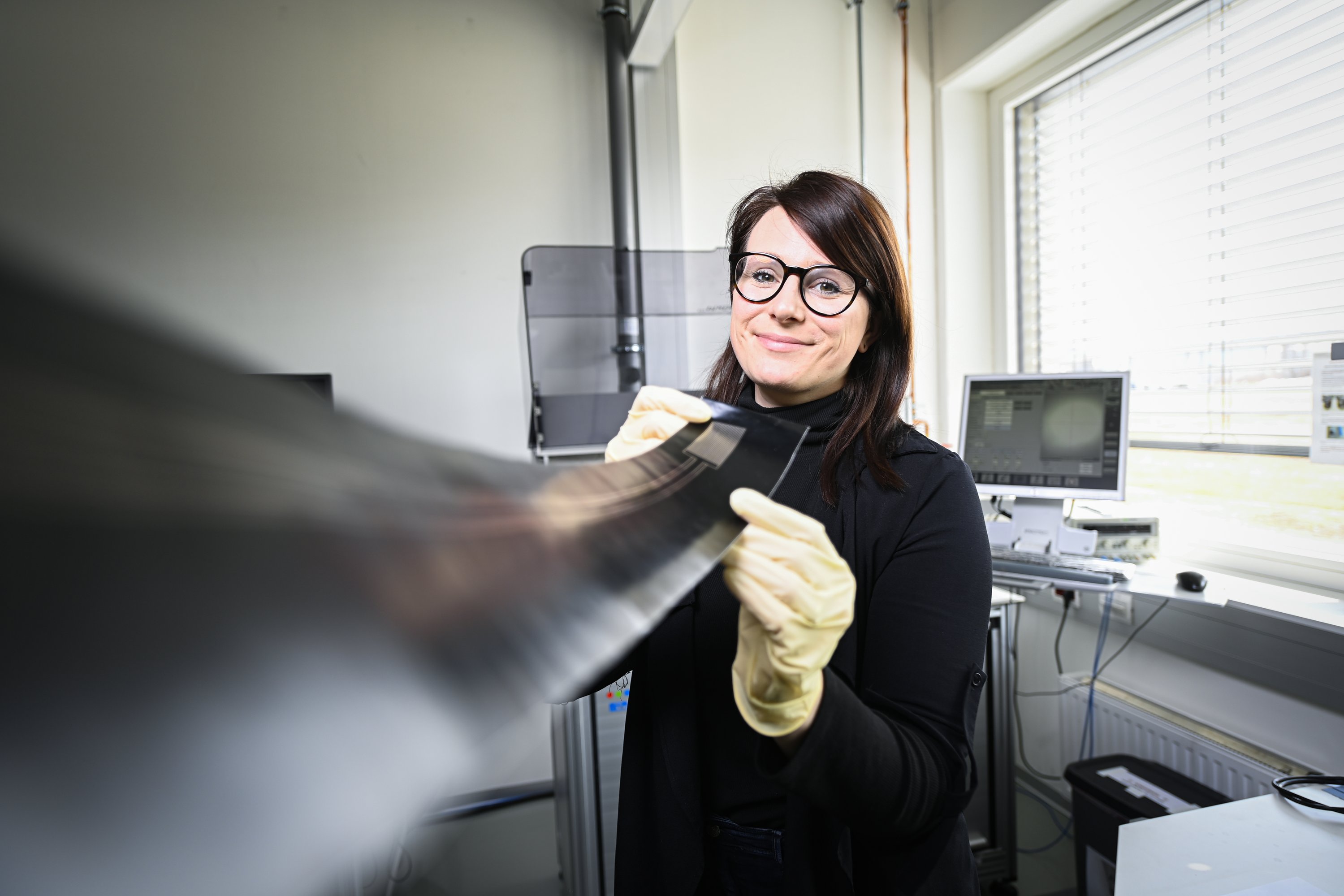 female researcher wearing gloves