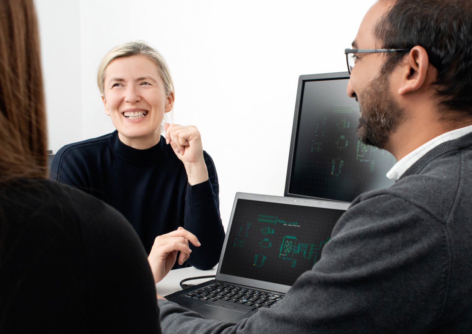 A couple of people laughing and talking together