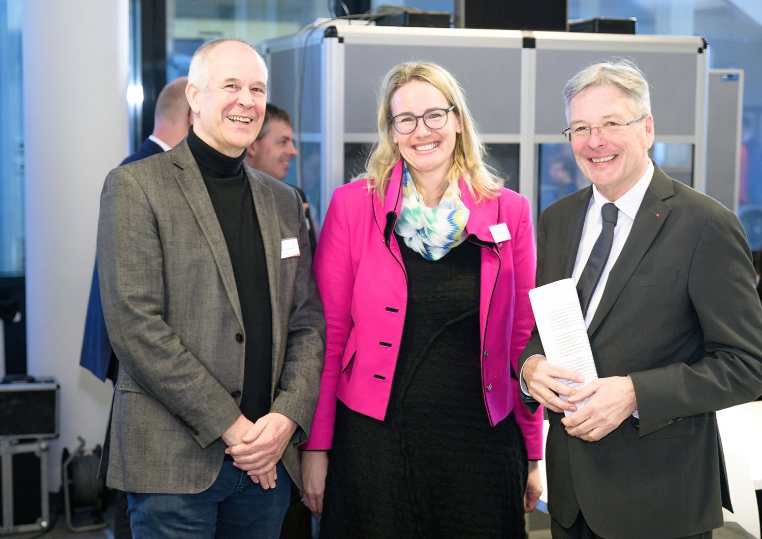 Three people smiling for the camera