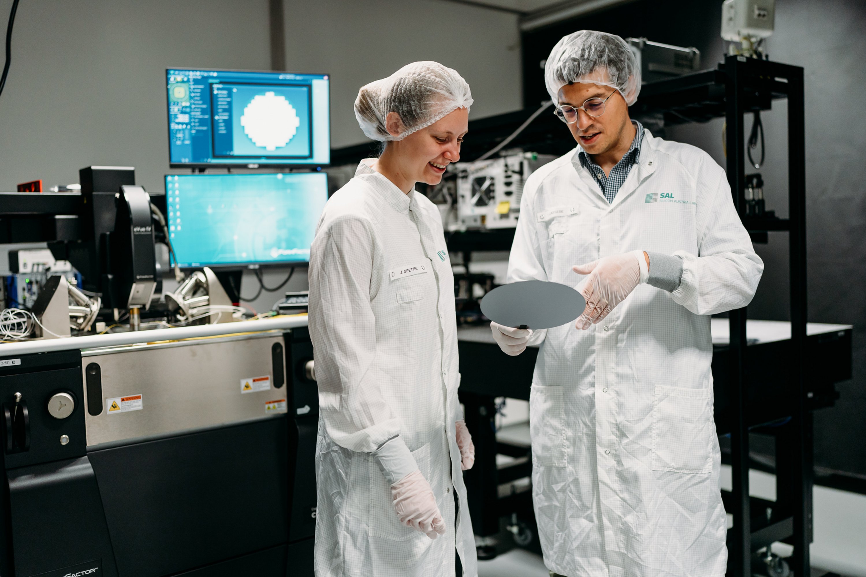 two women in a lab, smiling