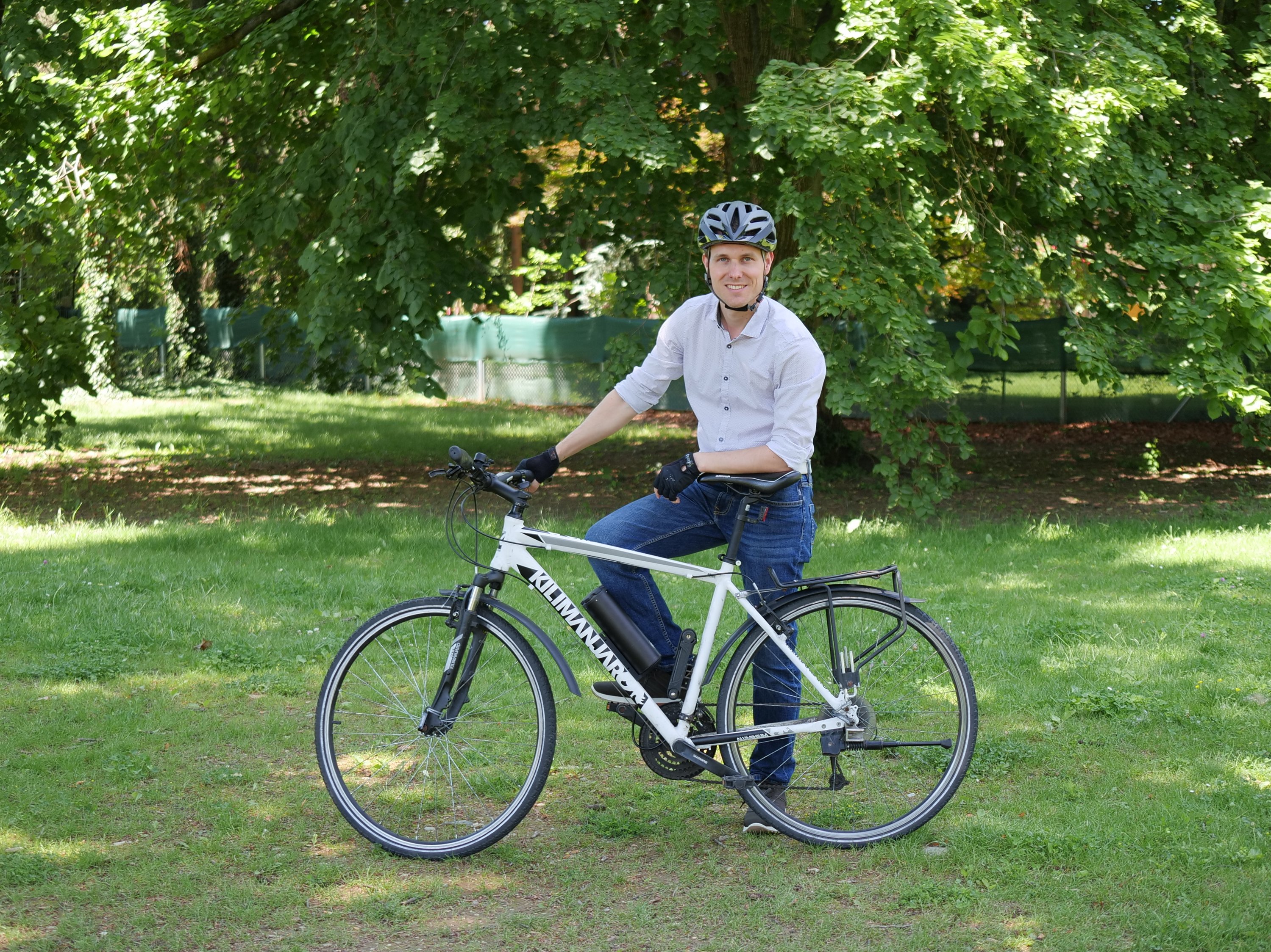 Herbert posing with bike helmet on his bike